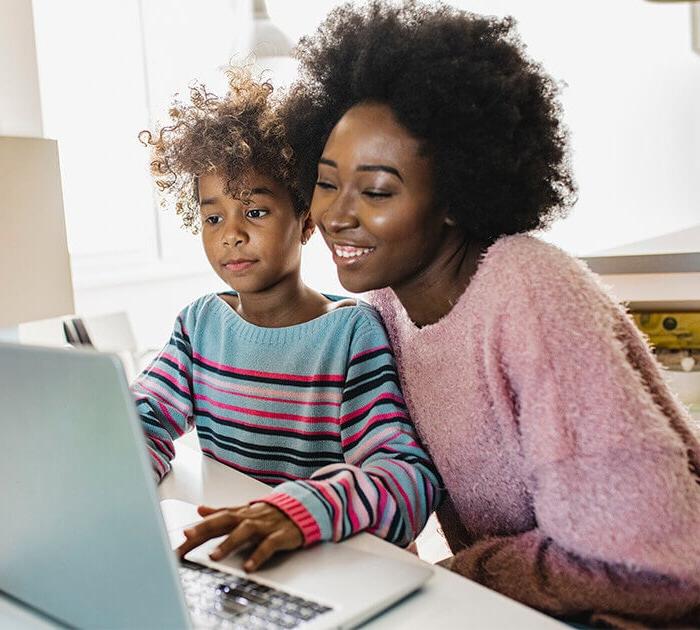 Mother and daughter studying together on a laptop - Connections Academy